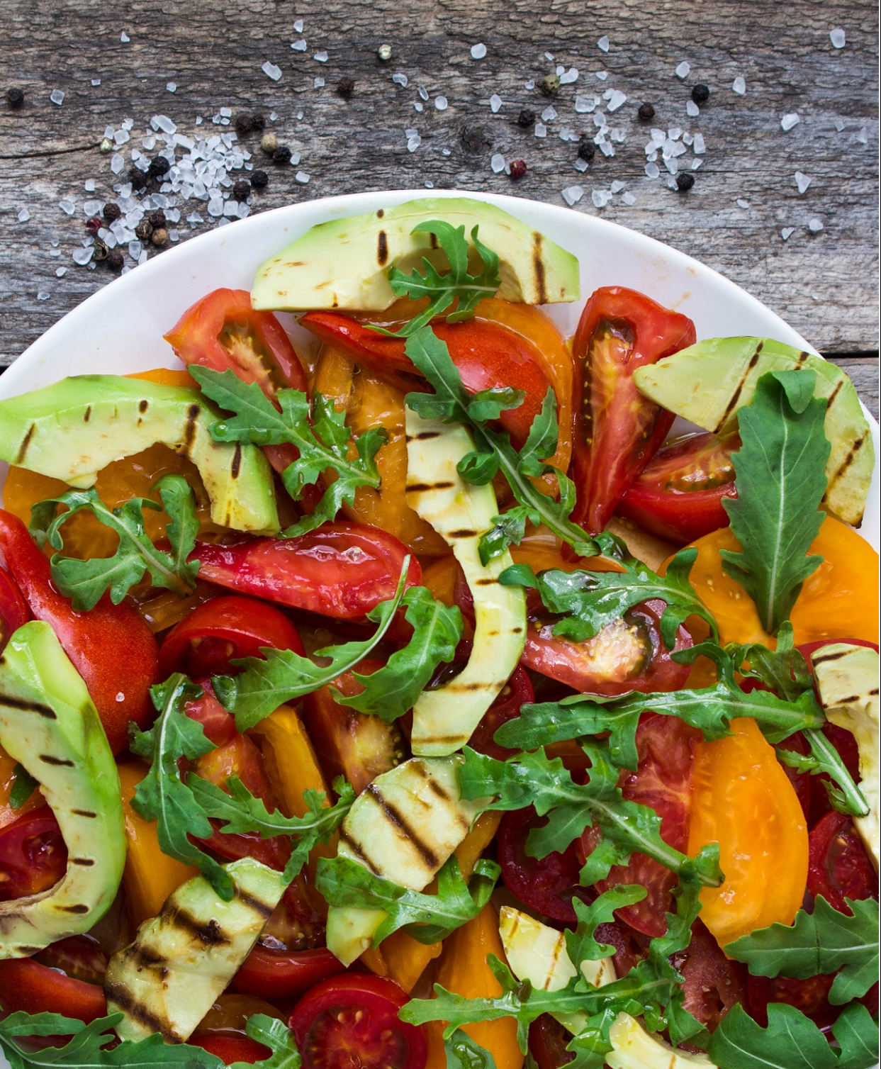 Arugula salad with roasted avocado and tomato